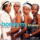 Group portrait of four performers in sequined outfits and headwear on a blue vinyl album cover