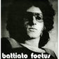 Black and white portrait of a man with curly hair and sunglasses on a vinyl record sleeve