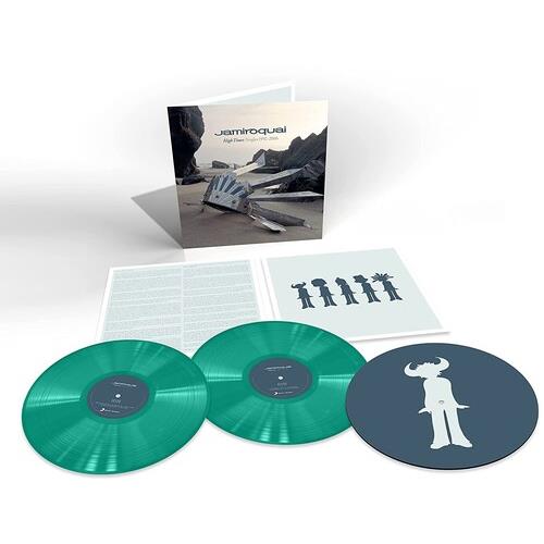 Deluxe vinyl set with two translucent green records and a dark blue record featuring a white silhoue