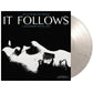 Black and white marble colored vinyl record with a black album cover featuring a white silhouette of
