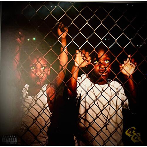 Vinyl LP cover art featuring two figures behind a chain-link fence with glowing eyes