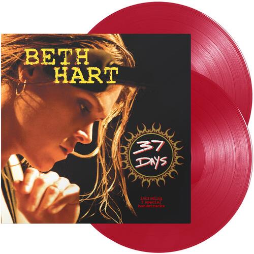 Transparent red vinyl LP with album cover featuring a woman singing into a microphone