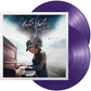 Purple translucent vinyl record displayed next to album cover art featuring a woman playing piano