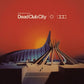 Vinyl LP cover featuring a futuristic architectural structure against a vibrant orange sunset sky
