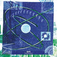Blue vinyl record sleeve with abstract space-themed artwork featuring a central white circle and int