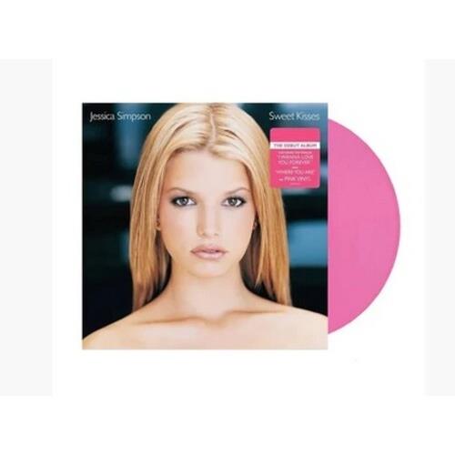 Opaque pink vinyl record partially removed from album sleeve featuring a portrait of a blonde woman