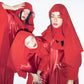 Three women in red hooded satin outfits posing against a white background