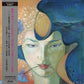Beige vinyl LP sleeve featuring a surreal portrait of a woman with blue hair and a flower in her mou