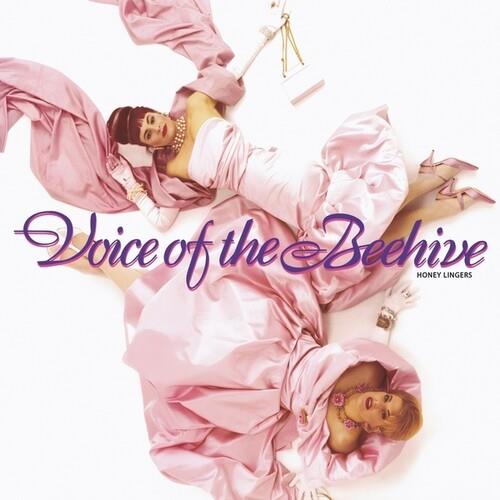 Two women in flowing pink satin dresses with purple script text overlay