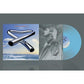 Light blue translucent vinyl record with album cover art featuring chrome tubular bells over an ocea