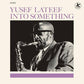 Black and white album cover featuring a man playing a saxophone