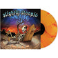 Yellow and orange marbled vinyl record next to album cover featuring a skeleton in a desert