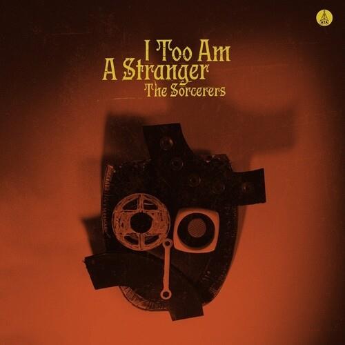 Vinyl LP cover featuring a dark mask with mechanical eye details on a burnt orange background