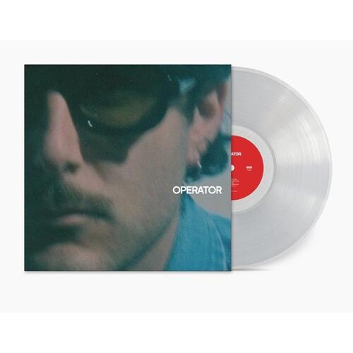 Clear vinyl record with red center label and album cover featuring a close-up portrait