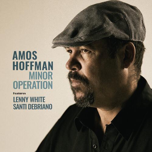 Portrait of a man wearing a flat cap and black shirt with album text overlay