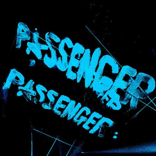 Transparent blue vinyl record with stylized text on a black background