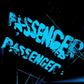 Transparent blue vinyl record with stylized text on a black background