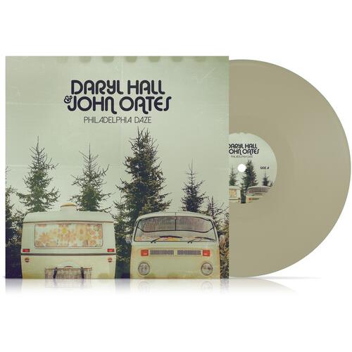 Gray vinyl record with album cover showing two vintage vans parked among pine trees