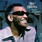 Portrait of Ray Charles wearing dark sunglasses and a light blue striped shirt