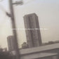 Vinyl LP cover featuring a grainy black and white photograph of a tall apartment building