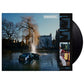 Vinyl LP record sleeve featuring a car submerged in a pond with a fountain and a large house in the 