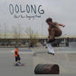 Vinyl LP cover featuring a skateboarder mid-air at a skatepark with a child watching