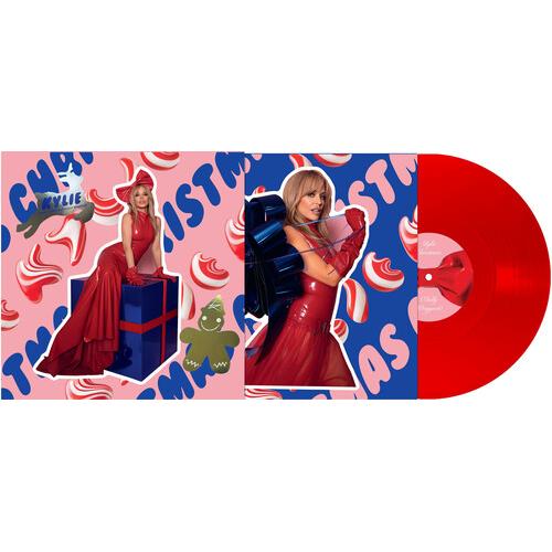 Red vinyl record with a pink and blue holiday-themed sleeve featuring a woman in a red gown