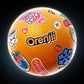 Orange vinyl record with colorful stickers including cherries and a snowflake
