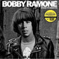 Black and white album cover featuring a man in a studded leather jacket and graphic t-shirt
