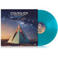 Turquoise blue vinyl LP with album cover featuring a geometric pyramid under a starry sky
