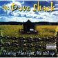 Album cover art featuring a small shack in a yellow field with a chain-link fence in the foreground