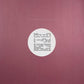 Maroon vinyl record with white center label and black text
