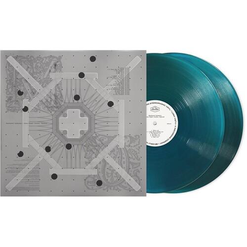 Translucent blue vinyl record with white center label next to gray album sleeve