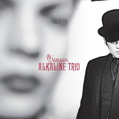 Black and white album cover featuring a man in a bowler hat with red text overlay