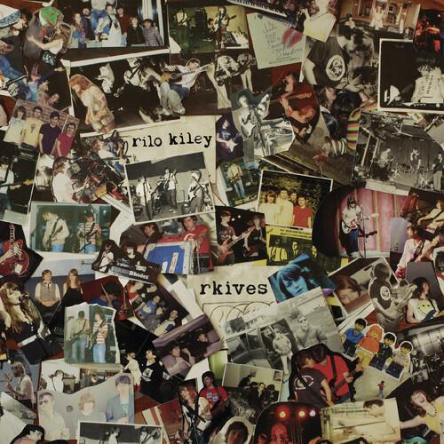 Collage of candid band photos and handwritten notes on a gold vinyl record sleeve