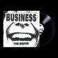 Black and white vinyl record sleeve featuring a close-up of a mouth with bold text