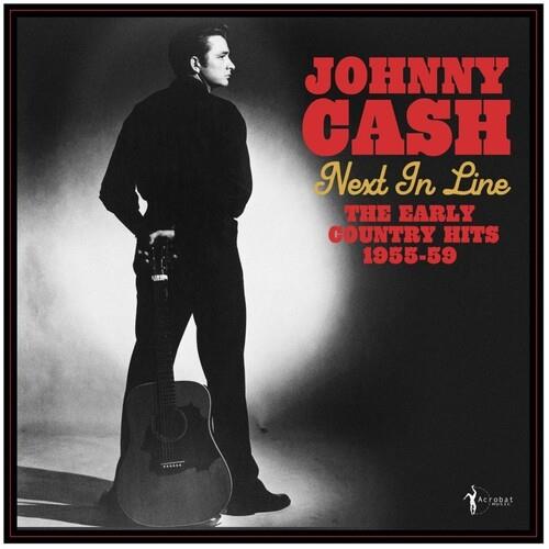 Black and white album cover featuring a man in dark clothing standing with an acoustic guitar