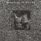 Black and white album cover with a dense web-like pattern and a central square portrait