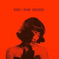 Vinyl LP cover featuring a woman with short dark hair against a bright orange background