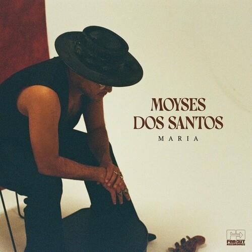 Vinyl LP cover featuring a man in a black hat and sleeveless shirt seated against a cream background