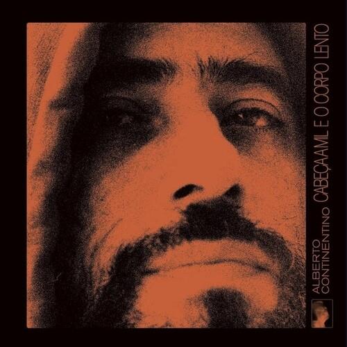 Vinyl LP cover featuring a high-contrast orange and black portrait of a man's face