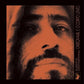 Vinyl LP cover featuring a high-contrast orange and black portrait of a man's face