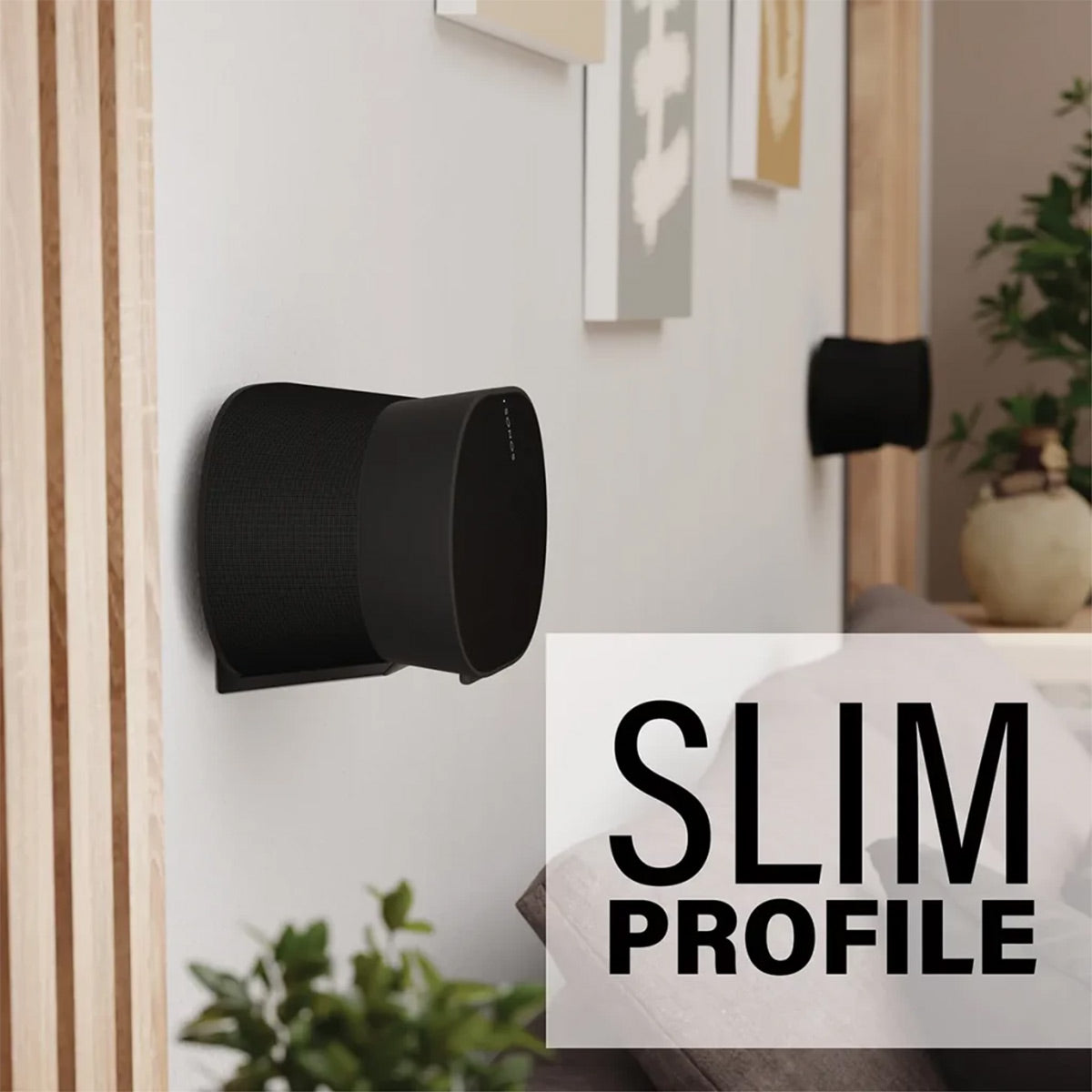 Black wall mount holding a speaker with a slim profile and low-profile bracket