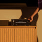 Black home theater receiver with dual control knobs and a digital display