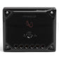 Black rectangular crossover with a central logo, a 0 dB to +3 dB adjustment switch, and six terminal