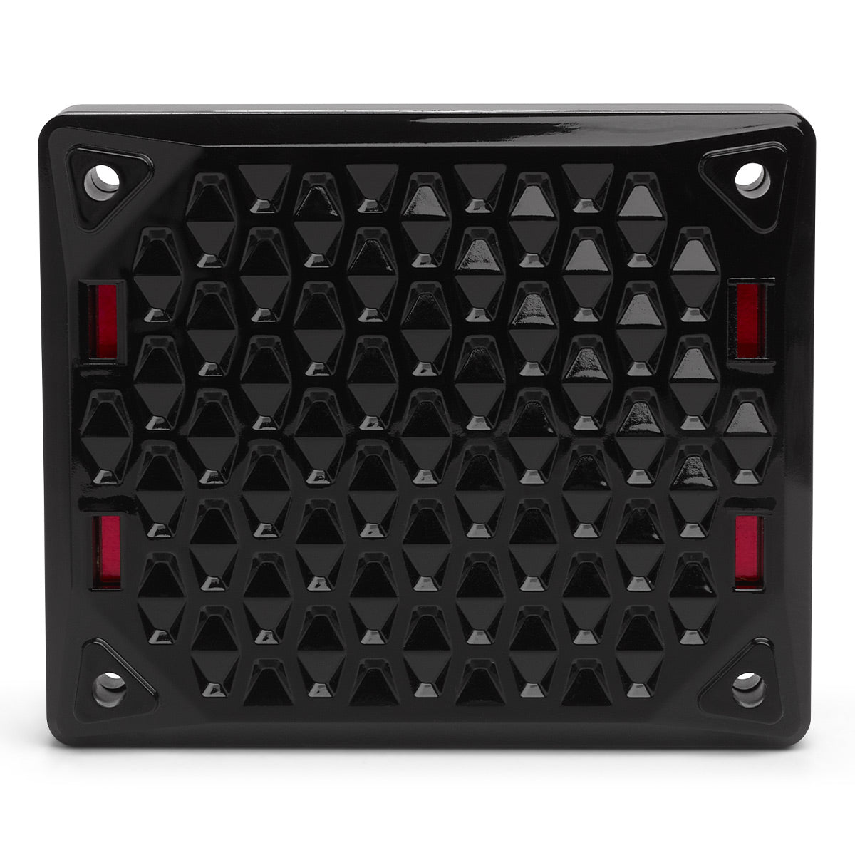 Black rectangular speaker grille with a geometric honeycomb pattern and red accents