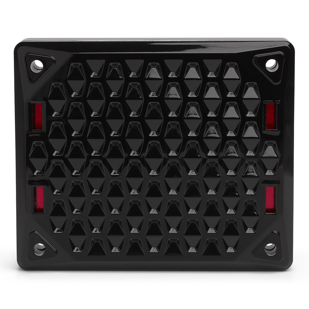 Black rectangular speaker grille with a geometric honeycomb pattern and red accents