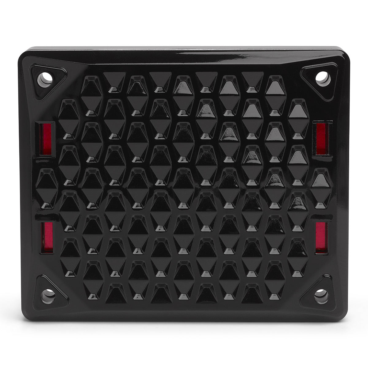 Black rectangular speaker grille with a geometric honeycomb pattern and red accents