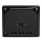 Black rectangular speaker with glossy finish, gold terminals, and a 0 dB to +3 dB adjustment switch