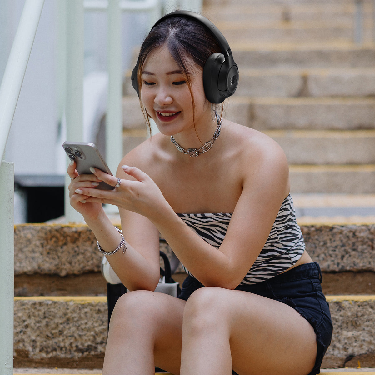 Black over-ear headphones with padded ear cups and a visible logo on the side